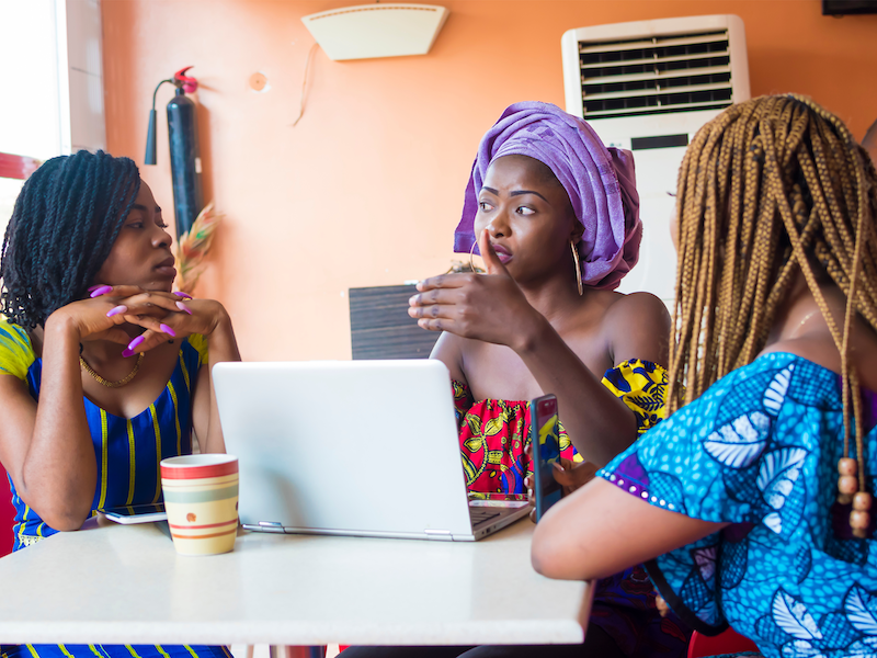 African women around table policymaking Shutterstock